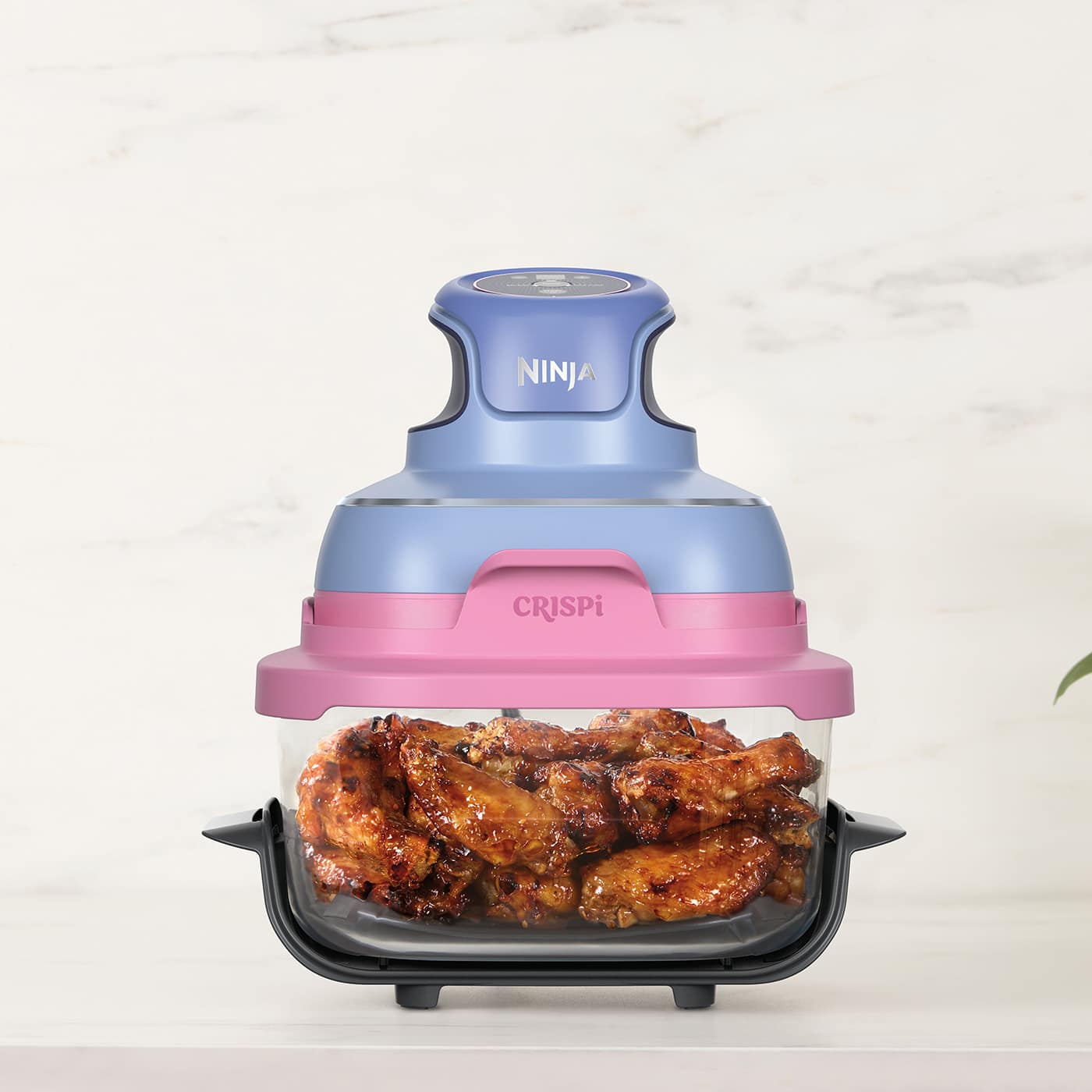 Ninja-FN101UKPRMV_InUse_Kitchen_Counter_4Quart_Cooking_Wings-TAFFY.jpg__PID:4f07cde8-80b0-4801-98d2-06b9e1c7ee60